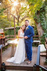Newlyweds taking romantic sunset photos during their Ojai The Ranch House wedding reception.