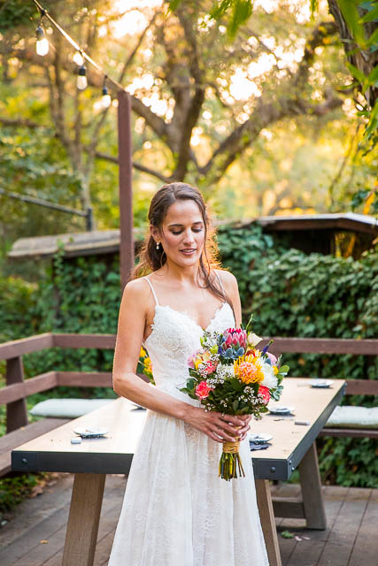 Newlyweds taking romantic sunset photos during their Ojai The Ranch House wedding reception.