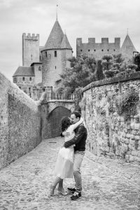 Castle Wedding photographs of couple walking together in the Cité de Carcassonne, a medieval fortress.