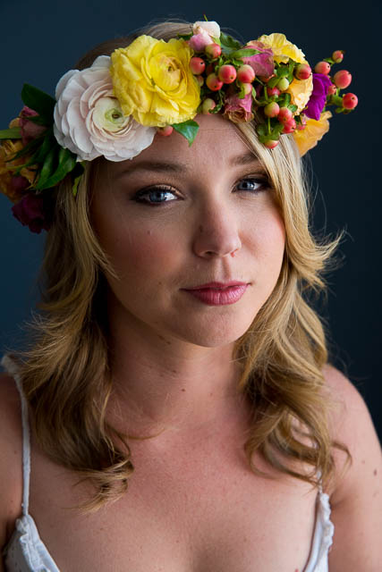 Feminine portrait of a woman with a flower crown at her Los Angeles boudoir photoshoot.