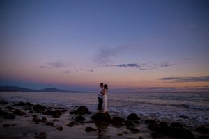A silhouette photo of a couple during their engagement photoshoot at the beach in Santa Barbara, California.