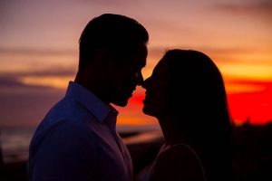 A silhouette photo of a couple during their engagement photoshoot at the beach in Santa Barbara, California.