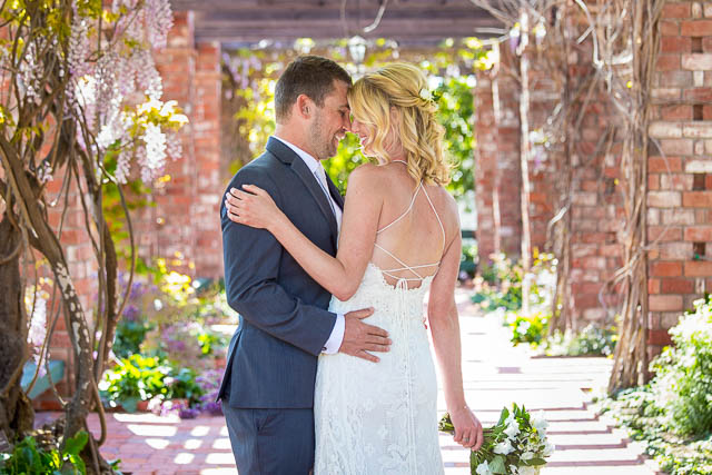 Bride and groom portraits at the Belmond El Encanto lilly pond.