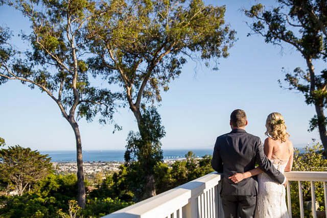Bride and groom overlooking the ocean view from the Belmond El Encanto Dinning Room Restaurant.