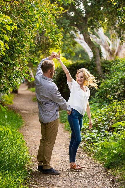 Lovers dancing together on the trail leading to the beach in Santa Barbara, California.