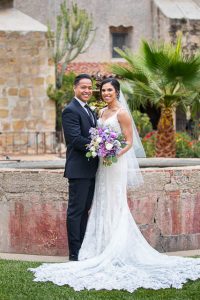 Newlyweds after their Mission Santa Barbara church wedding.