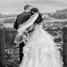 Romantic sunset photo of a couple kissing at their Skyline Rotorua wedding.