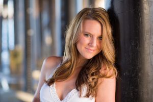 UCSB grad senior at the beach for her graduation photos.