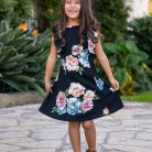 Girl twirling in dress at the Santa Barbara Courthouse.
