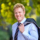 Headshot photo of a man for his LinkedIn profile photo.