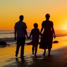 Silhouette photo of family laughing during their beach family photoshoot in Santa Barbara.