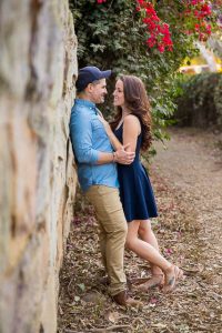 Newly engaged couple smiling during their creative engagment photographs.