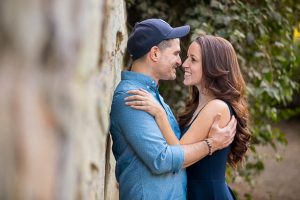 Newly engaged couple smiling during their creative engagment photographs.
