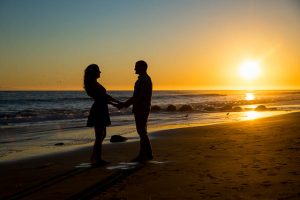 Sunset beach silhoutte engagement photos of couple at the beach in Santa Barbara, California.