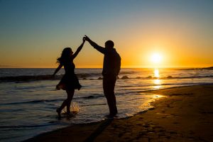 Sunset beach silhoutte engagement photos of couple at the beach in Santa Barbara, California.