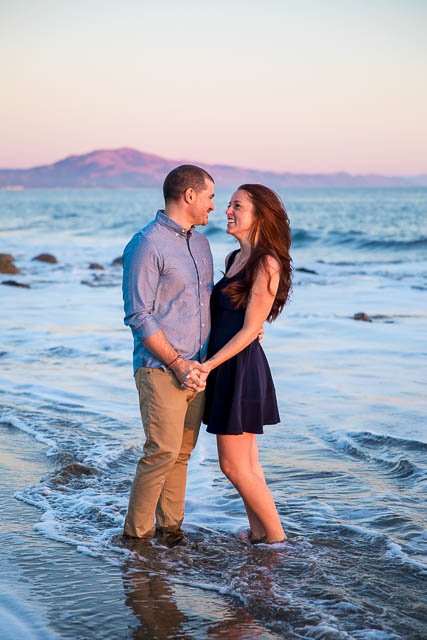 Engaged couple with a view of the ocean in Santa Barbara.