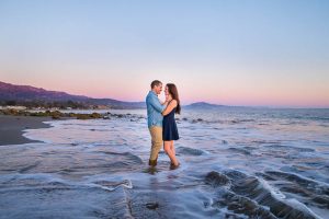 Creative engagement photography of engaged couple at the beach.