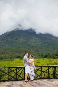 Engaged couple overlooking Arenal Volcano in La Fortuna, Costa Rica, during their La Fortuna engagment photoshoot.