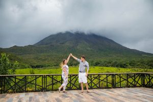 Newlyweds photos dancing in front of Arenal Volcano in La Fortuna, Costa Rica.