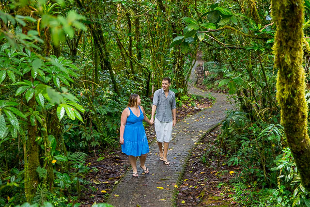 Engaged couple posing at the Selvatura Park at the cloud forest in Monteverde, Costa Rica.