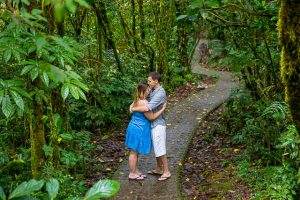 Engaged couple posing at the Selvatura Park at the raincloud forest in Monteverde, Costa Rica during their engagement photoshoot.