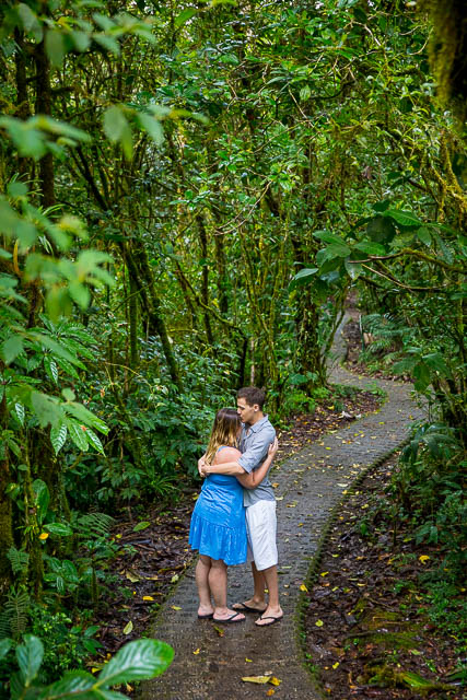 Engaged couple posing at the Selvatura Park at the raincloud forest in Monteverde, Costa Rica during their engagement photoshoot.