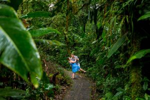 Engaged couple wandering in the Costa Rican cloud forest during their engagement photoshoot.