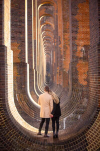 Couple hugging at the Ouse Valley Viaduct