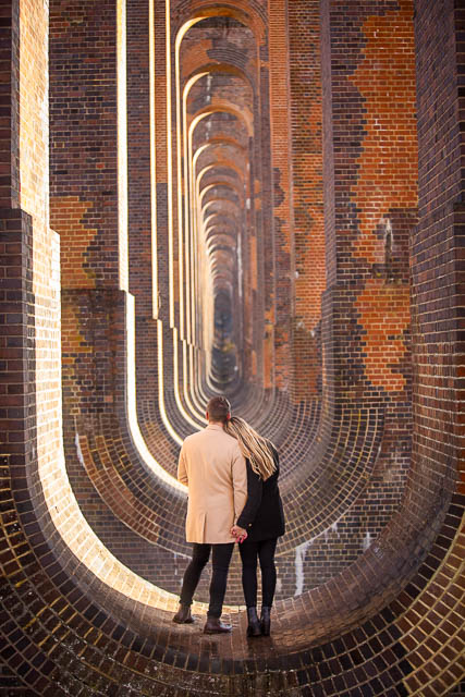 Couple hugging at the Ouse Valley Viaduct