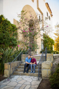 Husbands embracing at the Santa Barbara Courthouse.