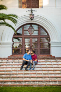 LGBTQIIA couple embracing at the Fiesta Stage steps at the Santa Barbara Courthouse