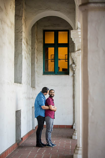LGBTQ couple embracing at their Santa Barbara Courthouse engagement photo session.