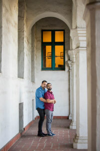 LGBTQ couple embracing at their Santa Barbara Courthouse engagement photo session.