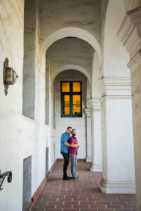 LGBTQ couple embracing at their Santa Barbara Courthouse engagement photo session.
