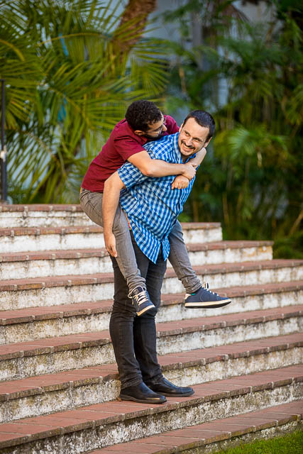 Gay couple embracing at the Fiesta Stage steps at the Santa Barbara Courthouse